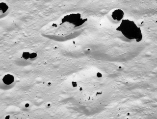 Illustration for article titled Saturn's Mysterious Splattered Moon
